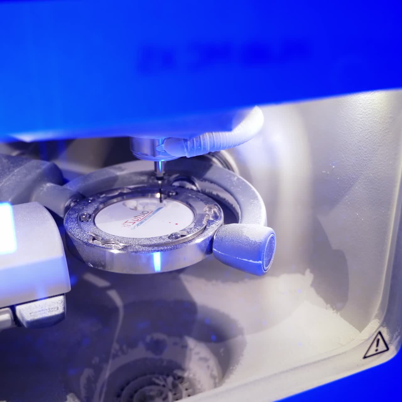 Advanced automated dental milling machine. Dental milling machine carving out shape of human teeth