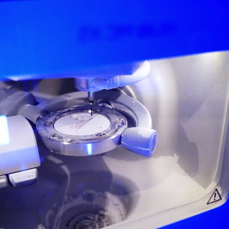 advanced automated dental milling machine. dental milling machine carving out shape of human teeth