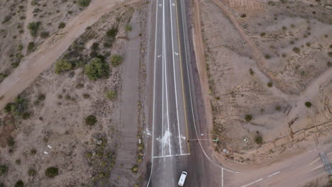 aerial pull-back over a crossroads in the desert