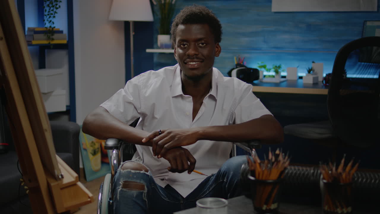 Black young artist with disability using tools for modern drawing