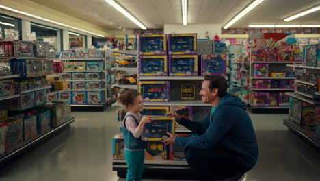 father and daughter shopping for toys in a store