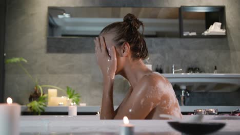 caucasian woman taking bath in hotel