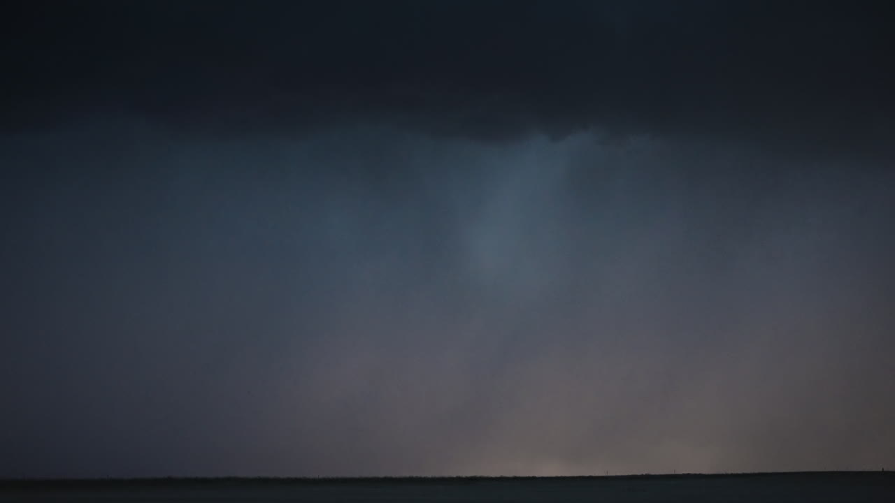 Rapid lightning flashes pulse across the sky in night storm footage