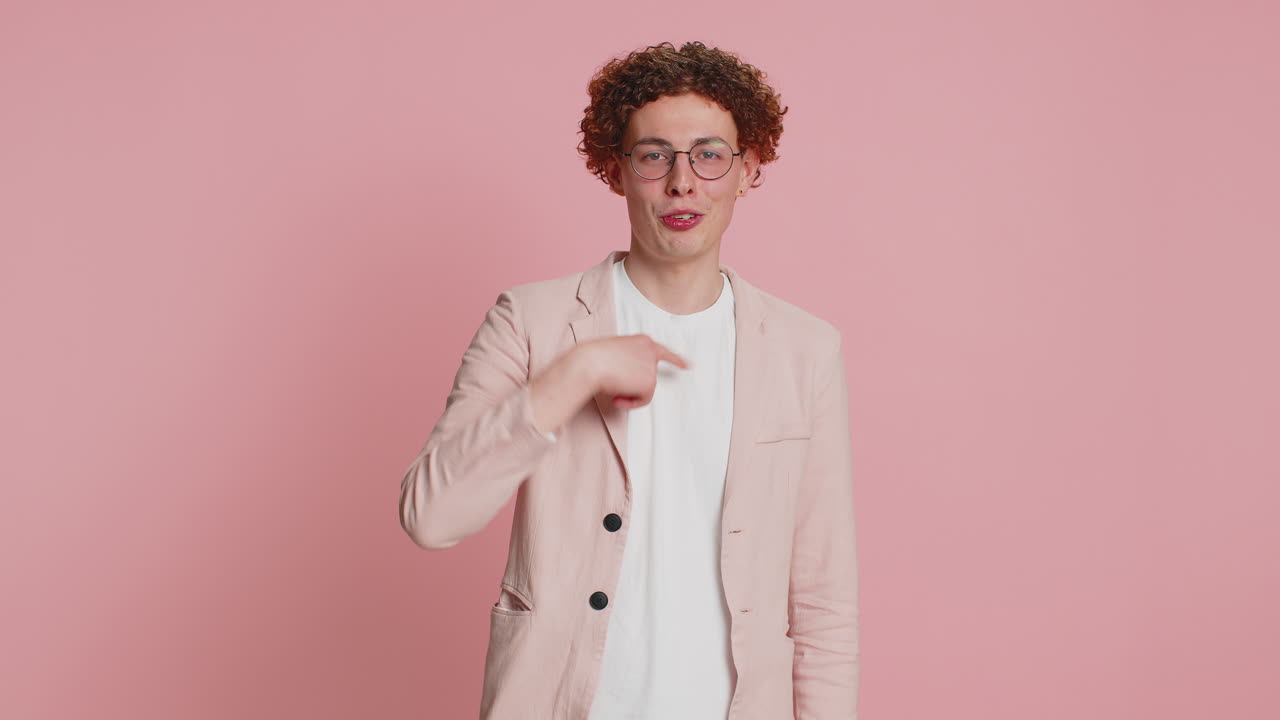 Smiling happy man pointing forward to camera choosing lucky victory winner indicating promotion