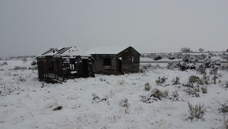 old abandoned rustic building in the snow