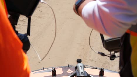 drone crew doing preflight checks before take off