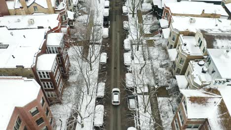 aerial, car driving on urban street