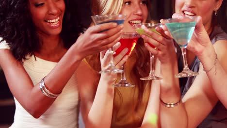 happy friends drinking cocktails