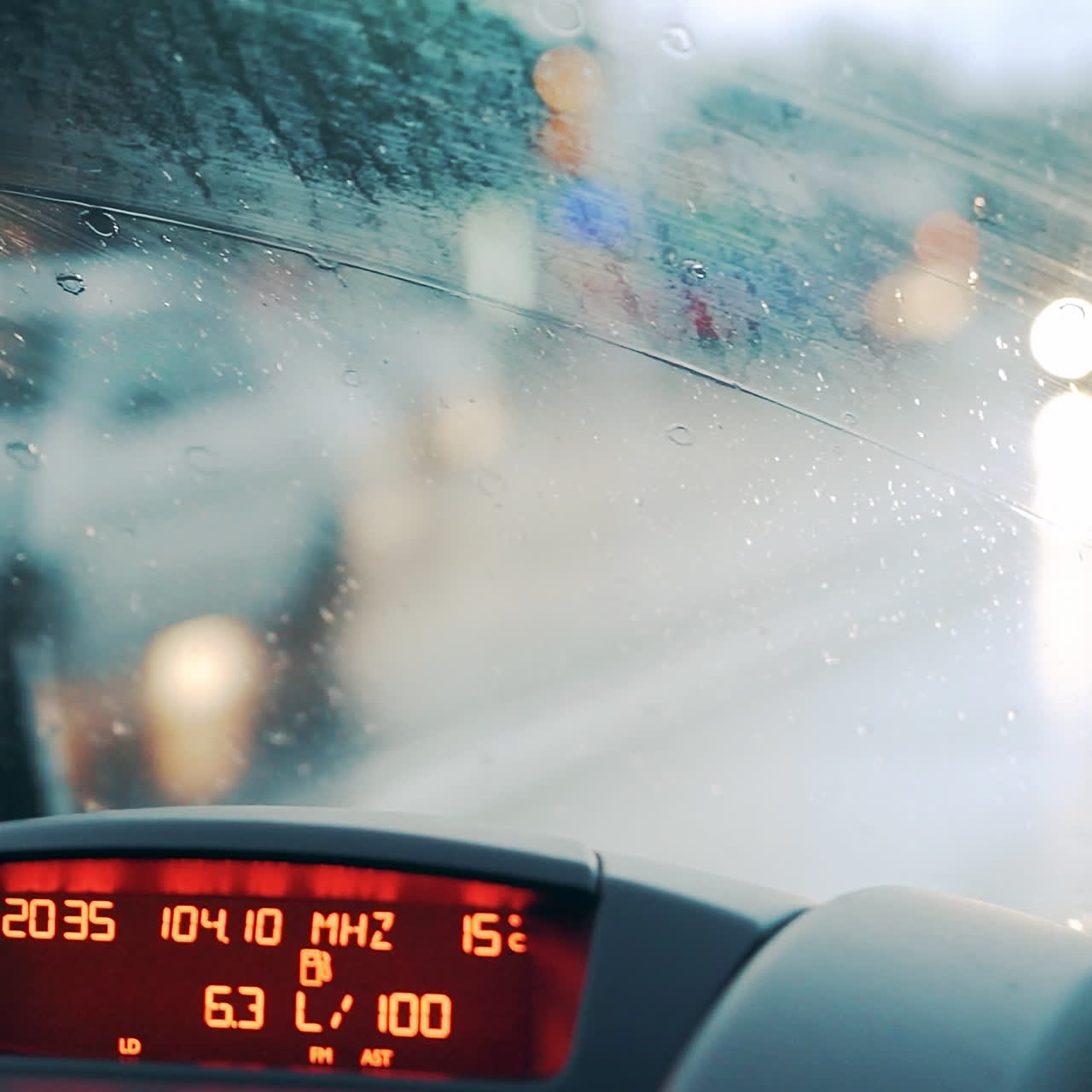 Windshield wipers work during heavy rains. Car dashboard. Close-up