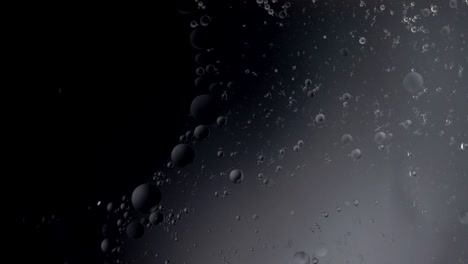 fantastic structure of colorful bubbles. chaotic motion. abstract colorful paint. top view. movement of bubbles in the liquid. oil surface multicolored background. macro