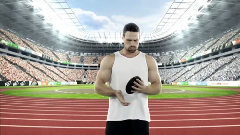 Male-athlete-practicing-discus-throw