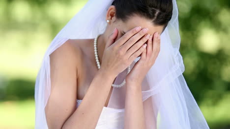 Upset-bride-sitting-on-the-grass