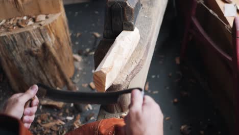 tracking shot of artisan craftsman carving wood on lathe