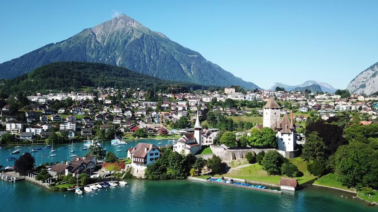 Aerial View of a Castle on a Lake in the Swiss Alps