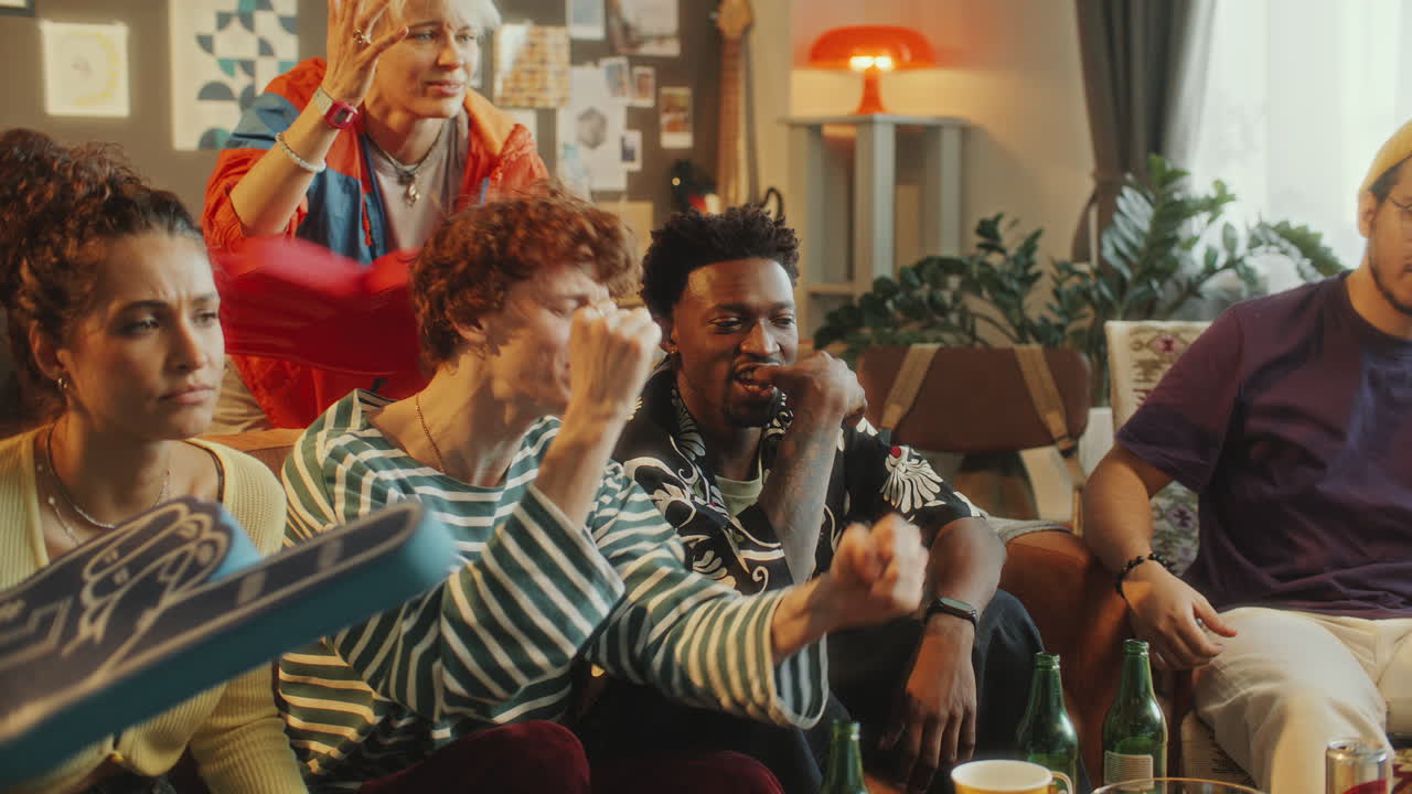 Sports Fans Watching Game on TV and Feeling Disappointment about Loss