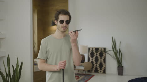 young blind man talking on the phone