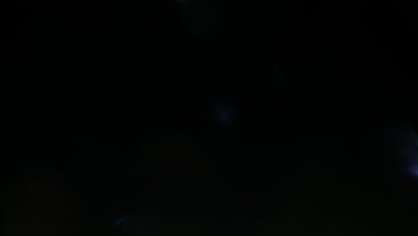 multicolored light leaks 4k footage on black background. stylizing video, transitions. bokeh effect