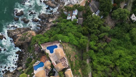 houses on cliffs with pools in puerto escondido, oaxaca offer stunning views of the ocean