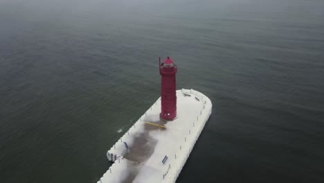 an ice storm melting into a heatwave in mid winter near a lighthouse