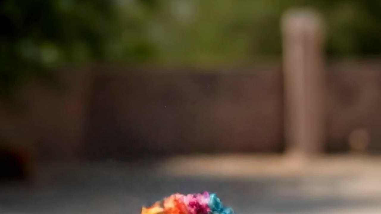 Hands Throwing Colorful Powder in the Air for Holi Festival