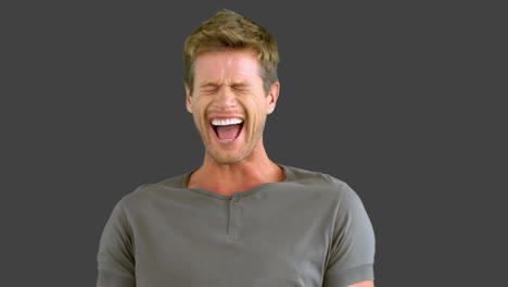 Man-laughing-on-grey-screen