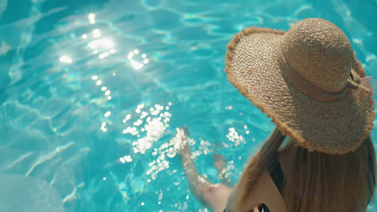 Woman relaxing in a pool
