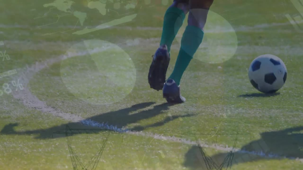 Animasi pemrosesan data statistik di atas bagian bawah pemain sepak bola pria yang sedang bermain sepak bola