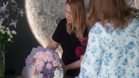 florist wrapping a beautiful bouquet