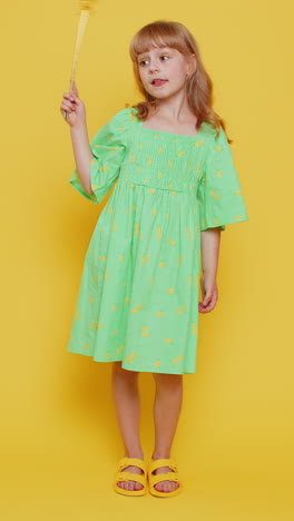 child girl witch gesturing with magic wand fairy stick making wish come true casting magician spell