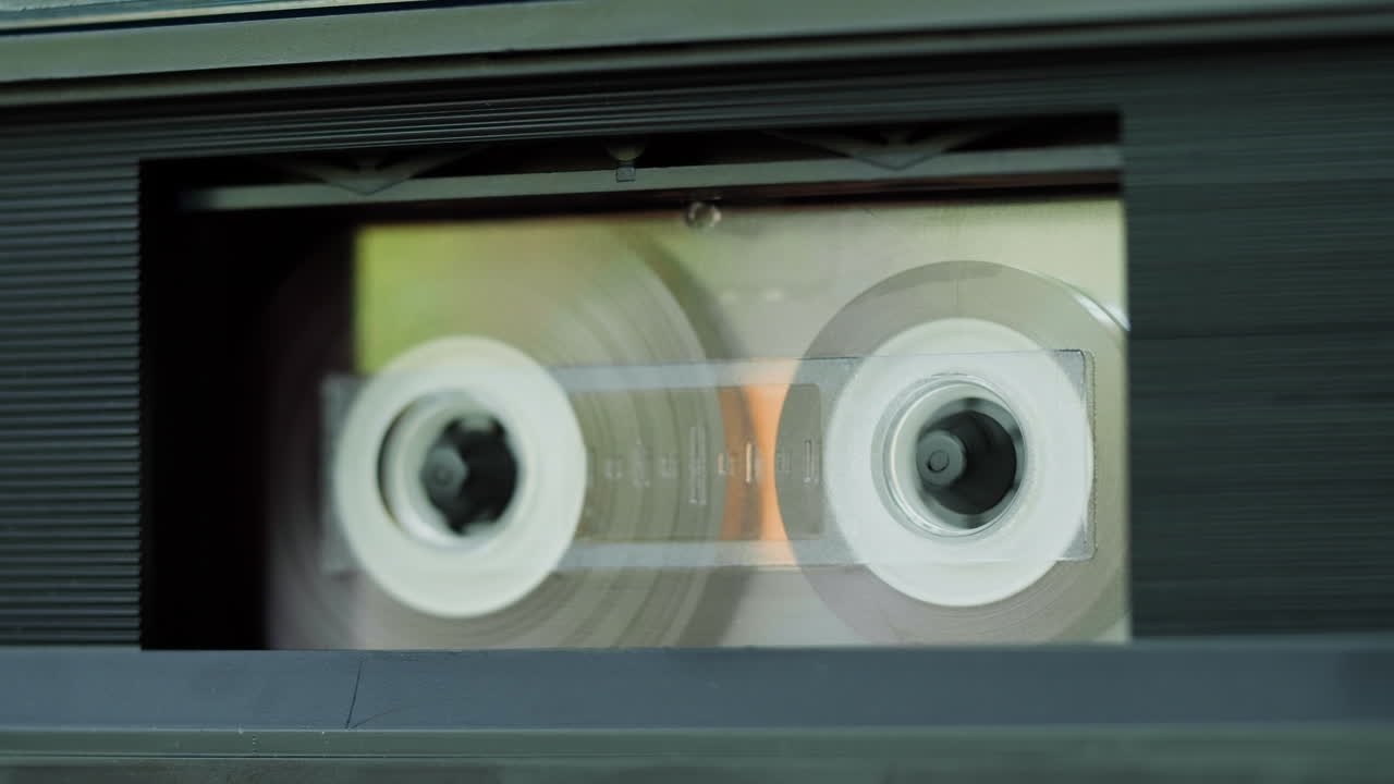 Close-up of a cassette tape in a tape player