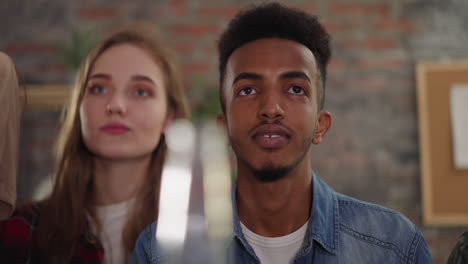 Bearded-black-guy-with-blonde-woman-watches-sports-game