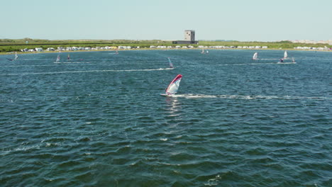 Windsurfing,-Extreme-Sport-In-Brouwersdam-Beach,-Netherlands---aerial-shot