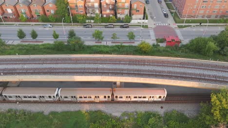 a commuter train passes through a chicago neighborhood