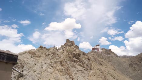 pan shot of namgyal tsemo buddhist monastery or gompa with upper himalayas landscape of leh ladakh india