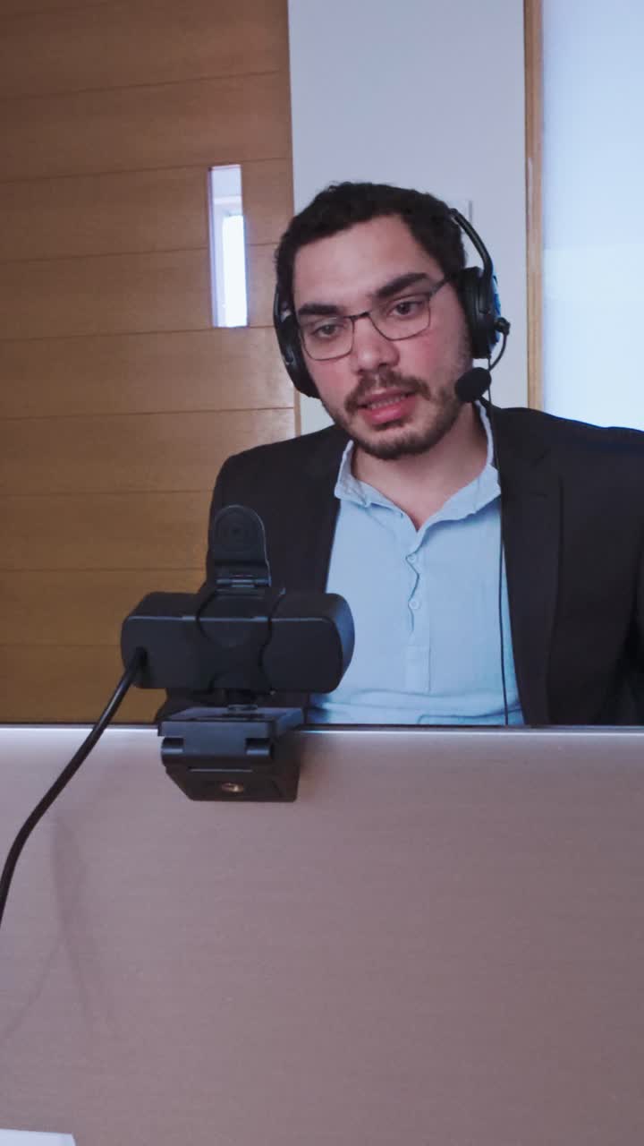 Professional Man Listening Intently During an Online Call