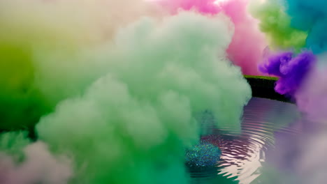 colorful smoke clouds over water