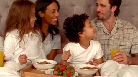 smiling hispanic family during breakfast time