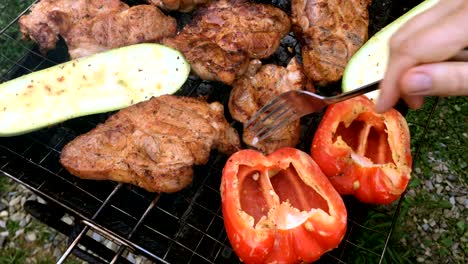 human hands prepares a pickled tasty pork or beef meat and vegetables.