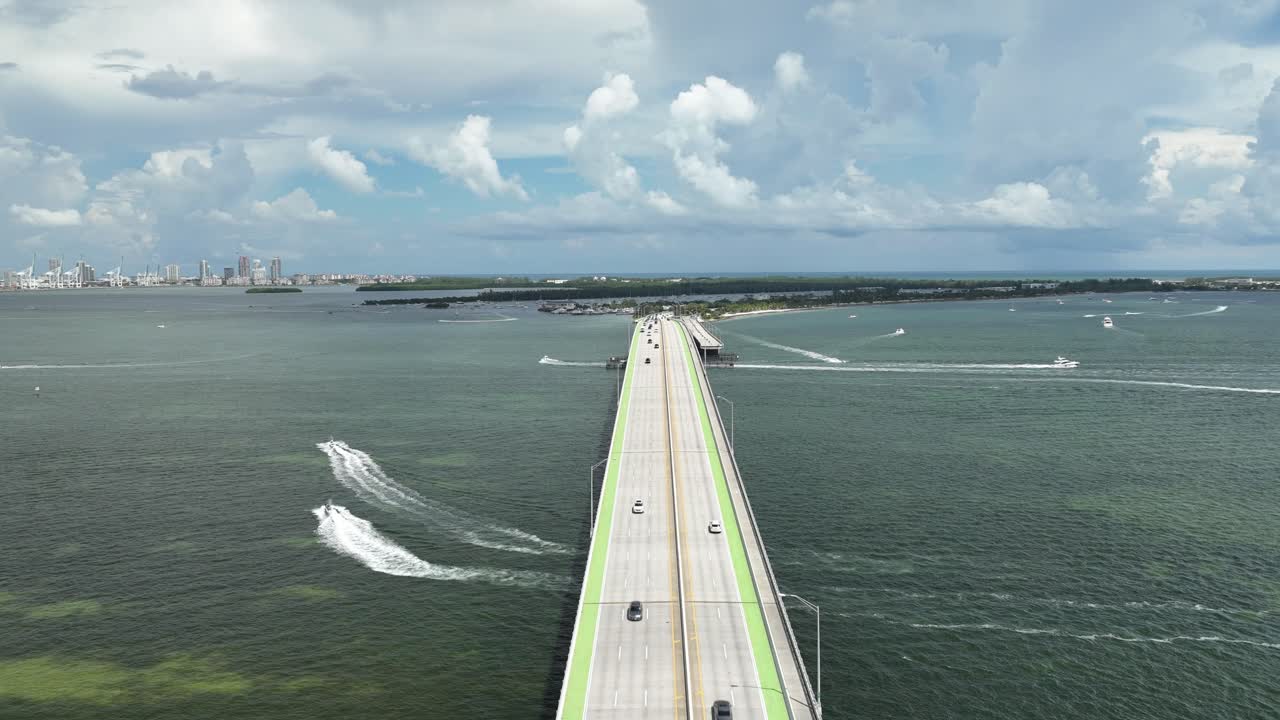 timelapse video of key Biscayne bridge with boats going under the bridge and cars driving over bridge in miami Florida