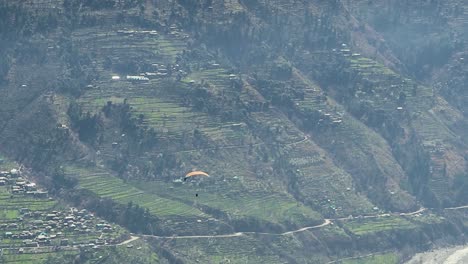 paragliding in mountains at morning with amazing landscape view