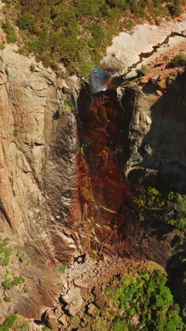 dried waterfall in yosemite national park, california, usa. steep cliffs with some vegetation on. view from top. vertical video