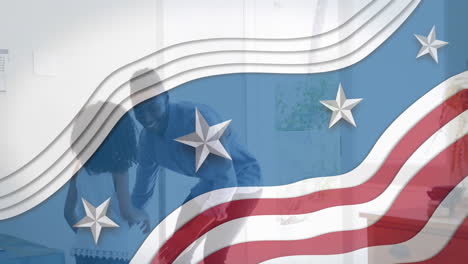 animation of flag of usa waving over african american father playing with daughter