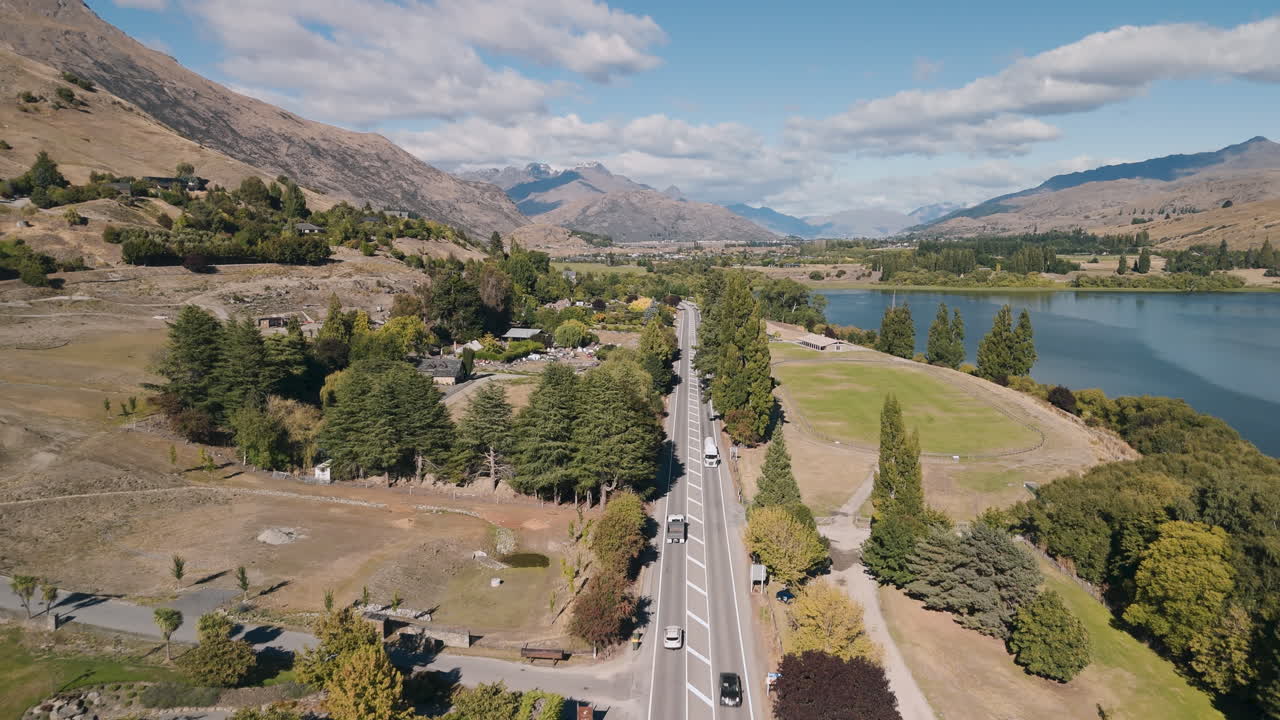 Aerial View of a Scenic Roadside Valley with a Lake