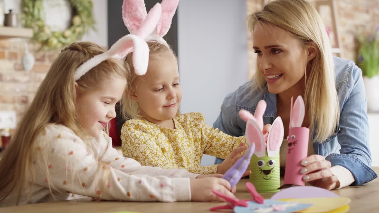 Video of mother playing with daughters using handmade Easter toys