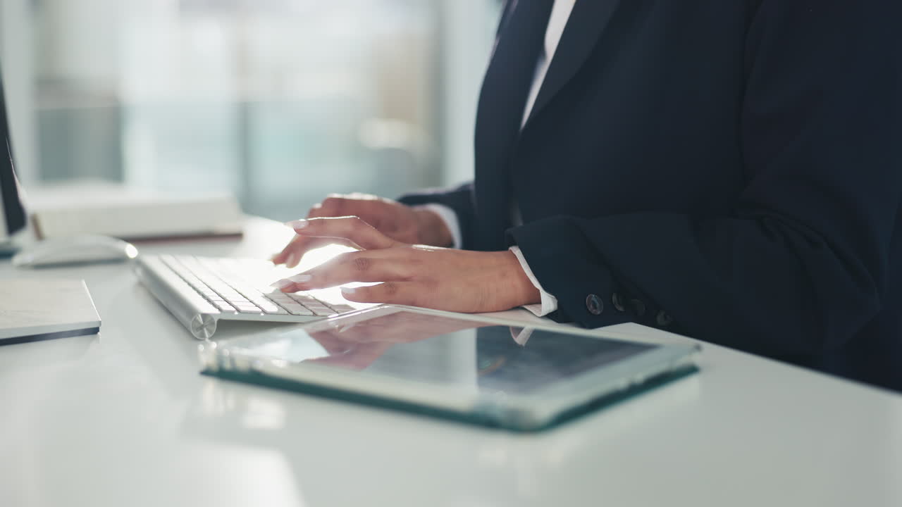 Businesswoman using tablet at desk