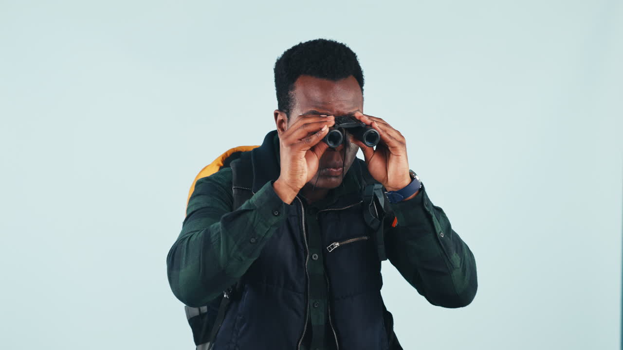 Man, studio and binocular for backpack hiking