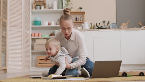 working mom pacifying energetic toddler