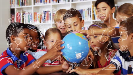in school, children exploring globe with animation of educational icons overlaying