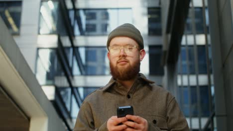 young man using smartphone in city