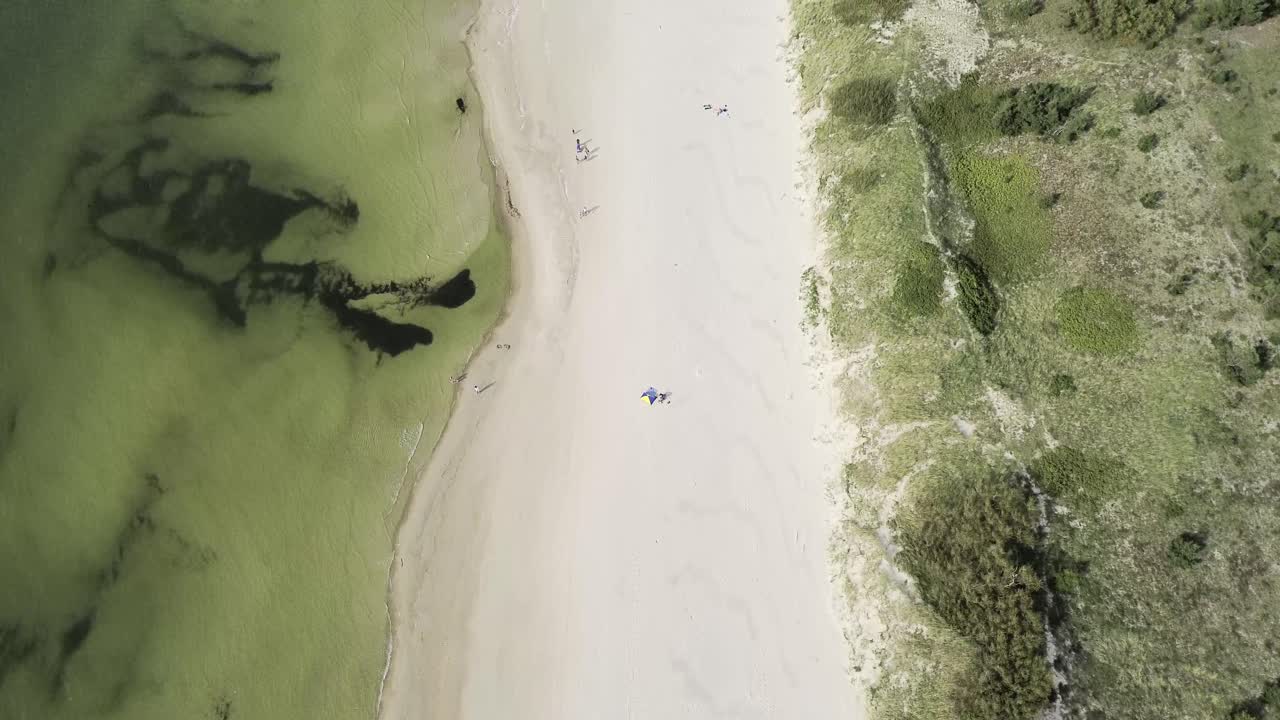 Experience a mesmerizing drone journey over the Baltic Sea's pristine beaches